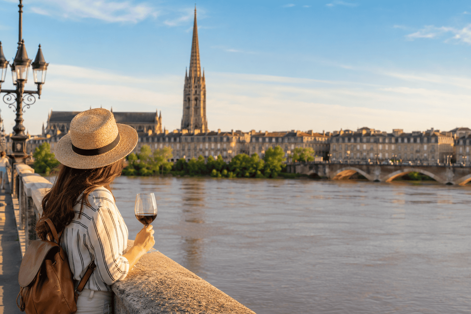 Leisurely riverside stroll in Bordeaux at sunset