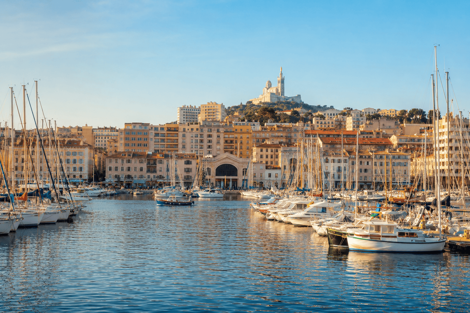 Sunlit boats in Marseille Old Port on a first-time visitor itinerary