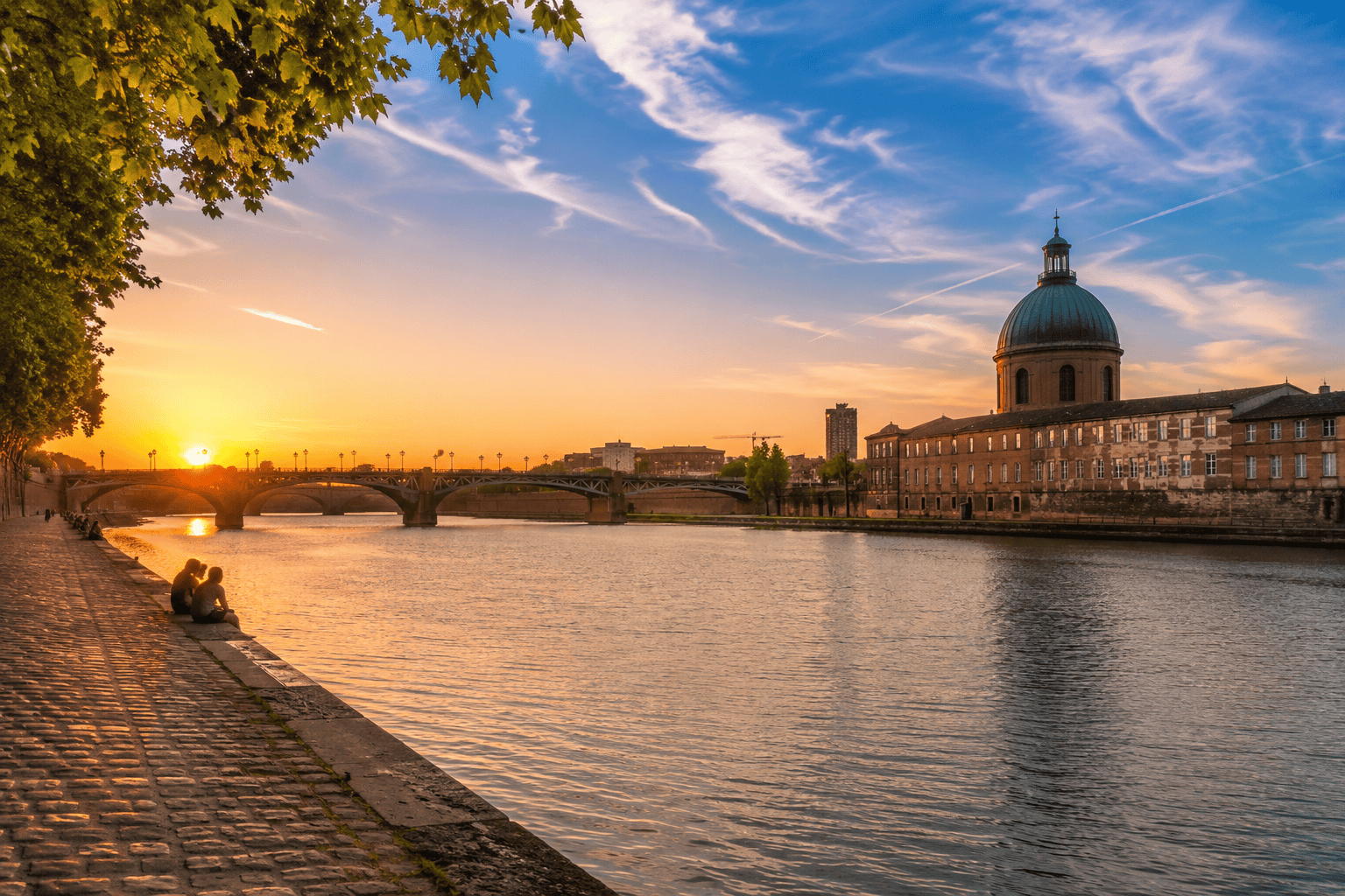 Sunset over Saint-Cyprien and the Toulouse riverside on the final day of a 3 day itinerary