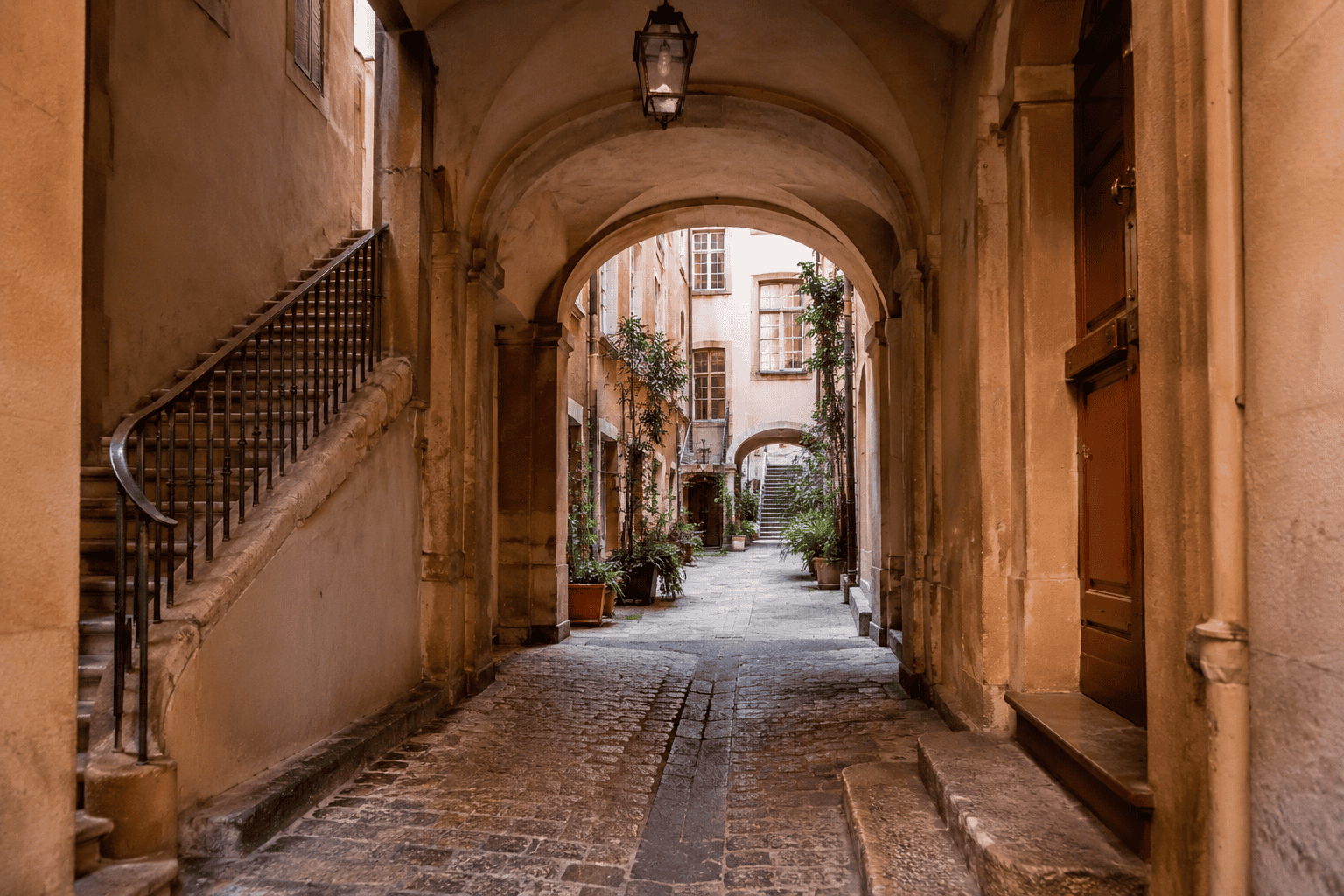 Stone archway leading to a courtyard in Vieux Lyon